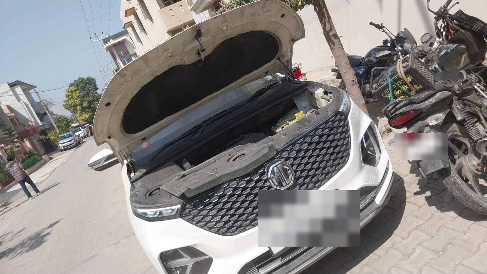 MG Hector with bonnet open during OnRoads India on-site inspection